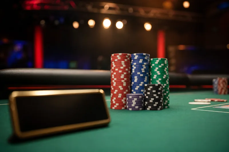 Stylised close-up photo of a stack of tournament chips on a WSOP feature table with a blurred player nameplate in the foreground, illustrating Day 2ABC of the 2026 WSOP Main Event at the Horseshoe and Paris in Las Vegas